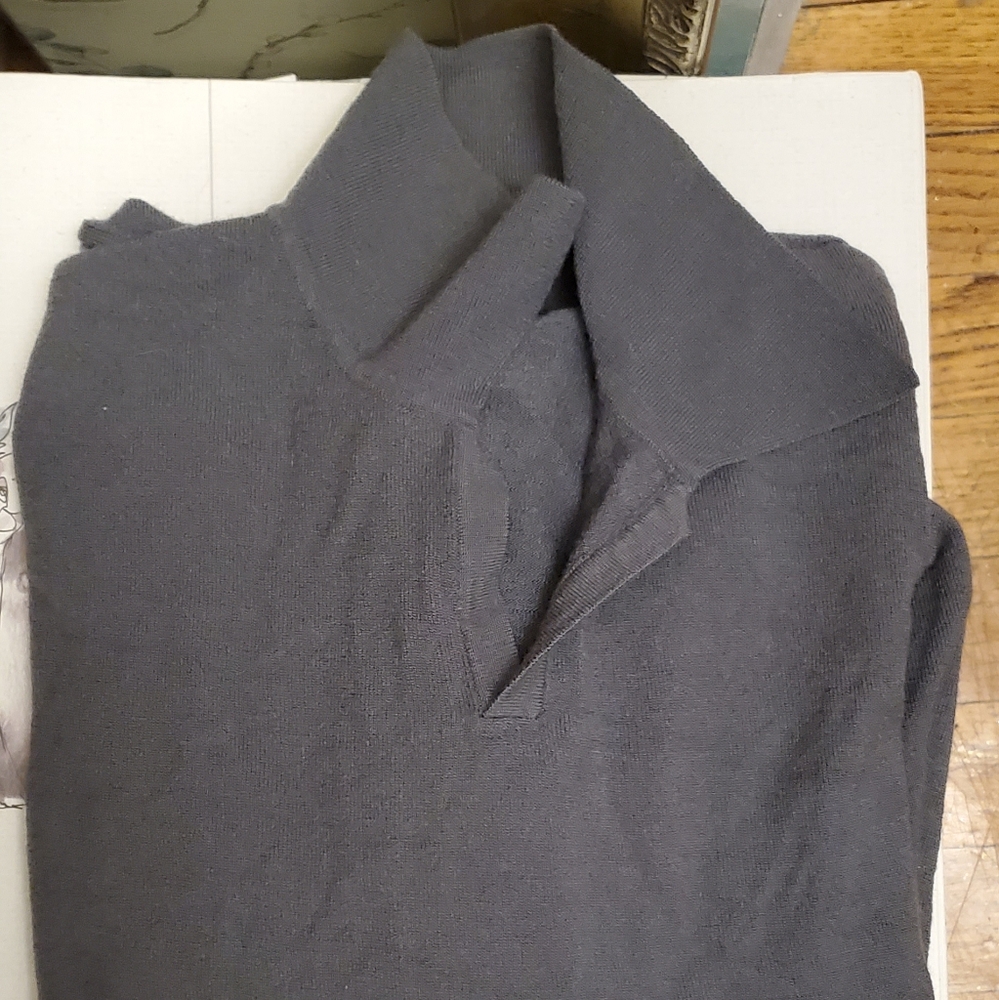 This is a men's shirt made by Metropolitan View in a size L.It is solid dark gr